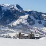 Town of Kitzbuehel in winter with Hahnenkamm and Streif on race day